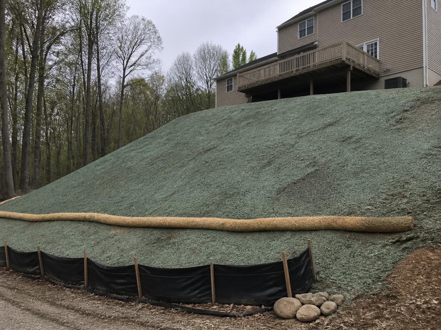 Restored residential lawn on a sloped lot